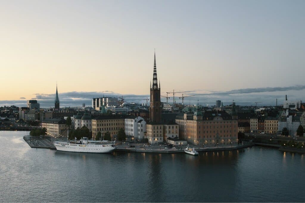 Riddarholmen seen across the water in Stockholm at dusk.