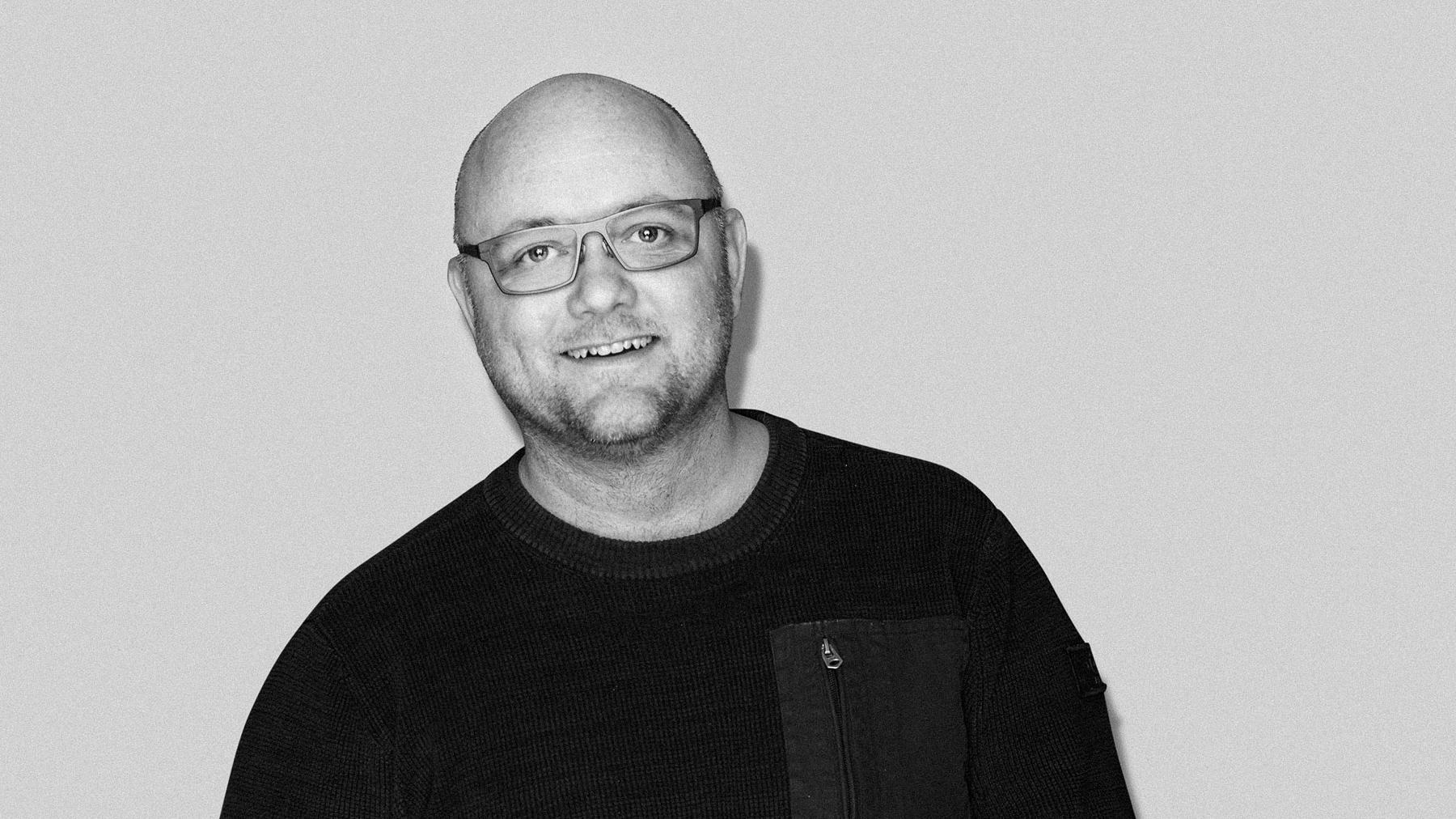 Black-and-white studio portrait of Martin Onsholm, Art Director at Stendahls.