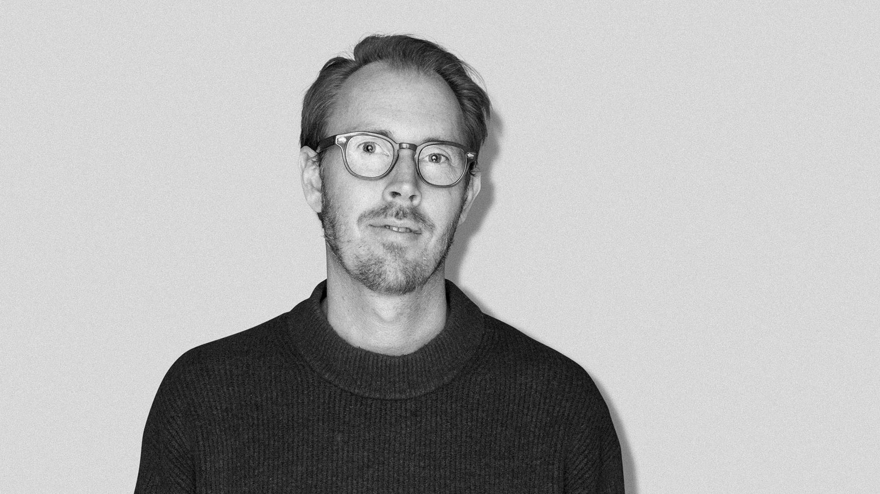 Black-and-white studio portrait of Oscar Plasidius, Creative Director at Stendahls.