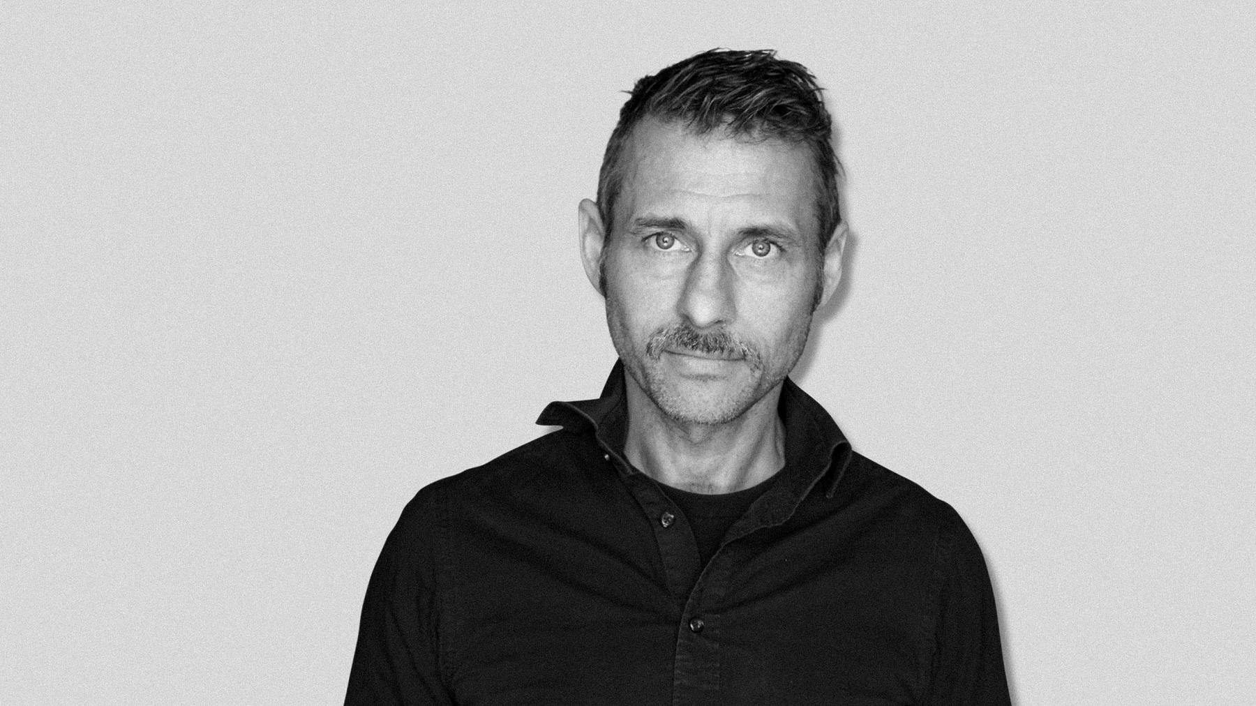 Black-and-white studio portrait of Tomas Amneskog, Art Director at Stendahls.