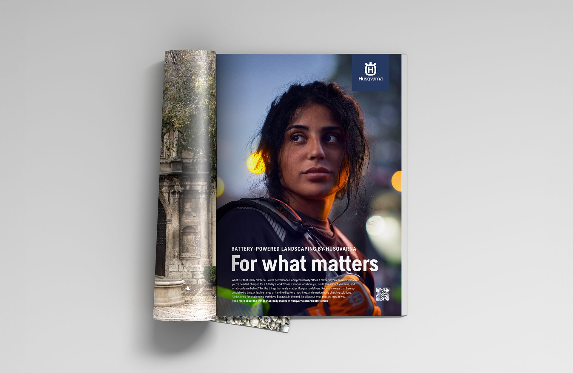 An open magazine with the full-page "For what matters" ad – a landscaper at dusk in hi-vis workwear, lit by warm street light.